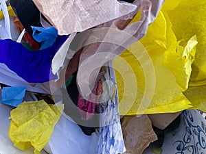 Recycling paper, plastic, cloths for art and crafts activity during an art lab at school- background art recycling concept