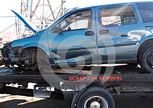 Recycling scrap car removal service for future dismantling and metal and parts reuse.