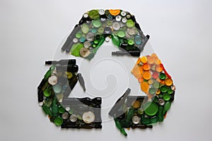 Recycling sign is created from trash. Environmental protection, recycle, ecology, concept