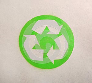 Recycling symbol on cardboard paper