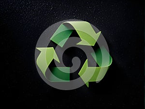 Recycling symbol made of paper on dark background. Recycling concept