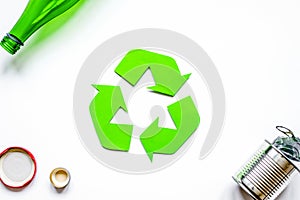 Recycling symbol with waste on white background top view mock up