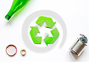 Recycling symbol with waste on white background top view mock up
