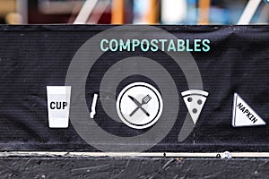 Recycling symbols on garbage bins compostables and recyclables