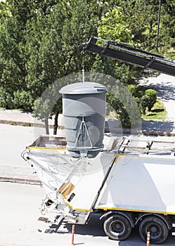 Recycling truck picking up bin