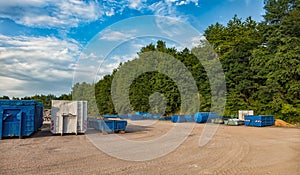 Recycling yard with different containers.