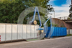 Recycling yard with press and containers