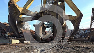 Recycling yard scrap metal. Scrap metal recycling plant and crane, close up