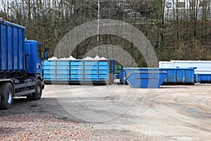 Recycling yard with trucks and containers