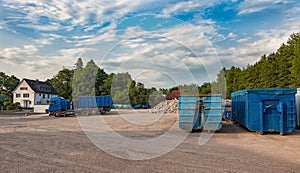 Recycling yard with trucks and different containers