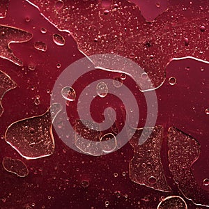 Red abstract background, liquids. Looks 3d. Strange texture with metallic sheen, bubbles and holes. Unusual oil and