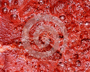 Red Abstract Background made of Beet Juice Foam Close-up