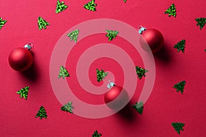 Red abstract Christmas background with Christmas balls and tinsel