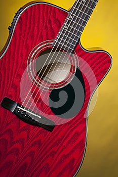 Red Acoustic Guitar on Yellow