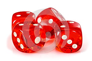 Red acrylic transparent dice for games. Four gambling translucent dices on white background, macro close-up high resolution