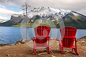 Red Adirondack Chairs at Lake Minnewanka in Banff National Park