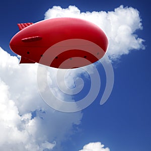 Red air ship in blue sky