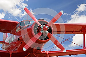 Red airplane biplane with piston engine