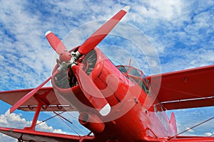 Red airplane biplane with piston engine