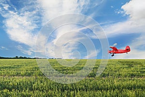 Red airplane biplane with piston engine