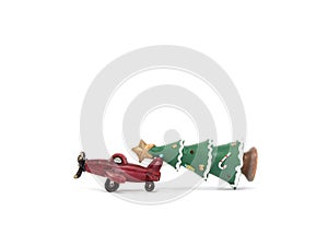 Red airplane lug green poinsettia on white background