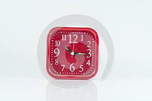 Red alarm clock isolate on the white background