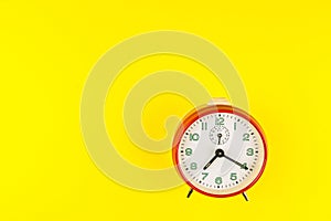 Red alarm clock isolated on yellow background, Time concept, Rush hour concept, Copy space image for your text, Flat lay