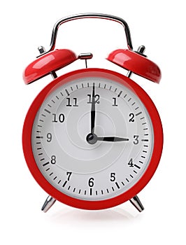 Red alarm clock set at three isolated over white background