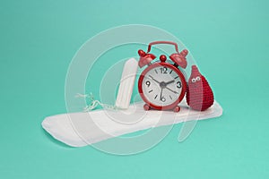 Red alarm clock, smile crochet blood drop, daily menstrual pad and tampon. Menstruation sanitary woman hygiene. Woman critical day