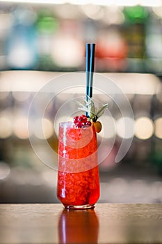 Red alcohol cocktail on the bar counter