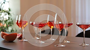 Red alcoholic drinks in glasses on the table