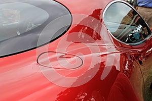 Red Alfa Romeo Italian sports car fuel door and window