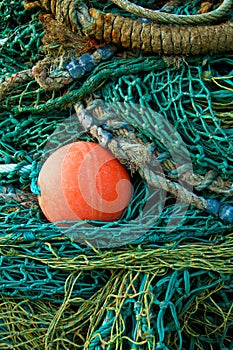 Red all amongst green fishing nets