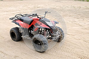 A red all terrain vehicle