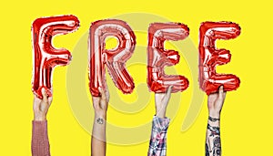Red alphabet balloons forming the word free