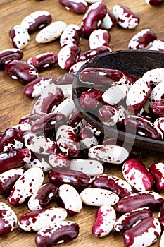 Red Anasazi Beans and wooden scoop. Spotted beans.Kidney beans.Haricot beans. Vegetarian food. Healthy protein food