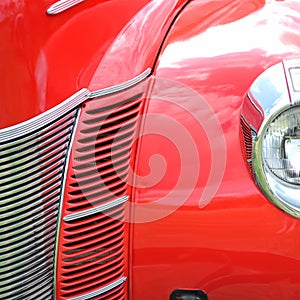 Red antique car extreme closeup