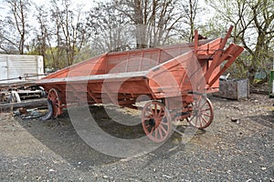 Red Antique Farm Wagon with sloping sides in Dufur, Oregon