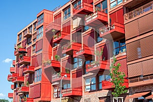 Red apartment building with balconies