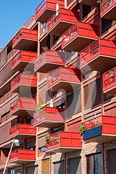 Red apartment building with big balconies