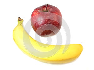 Red apple and banana isolated on a white background.