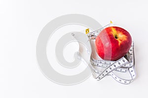 Red apple bind with tape measure for concept loss weight and diet healthy