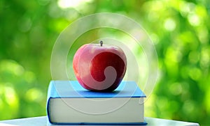 A Red Apple On A Book