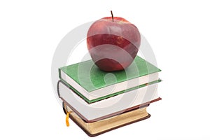 Red apple on a books isolated