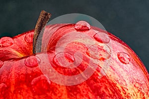 A Red Apple Close up view With Water Droplets