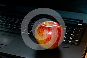 Red apple on computer keyboard