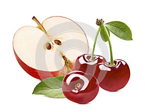 Red apple cut in half and three sweet cherries isolated on white background