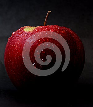 Red apple on dark background