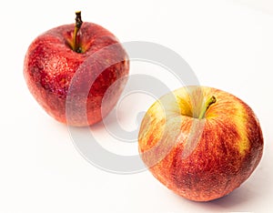 Red apple with drops isolated on white