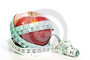 Red apple fitnes concept with centimeter.